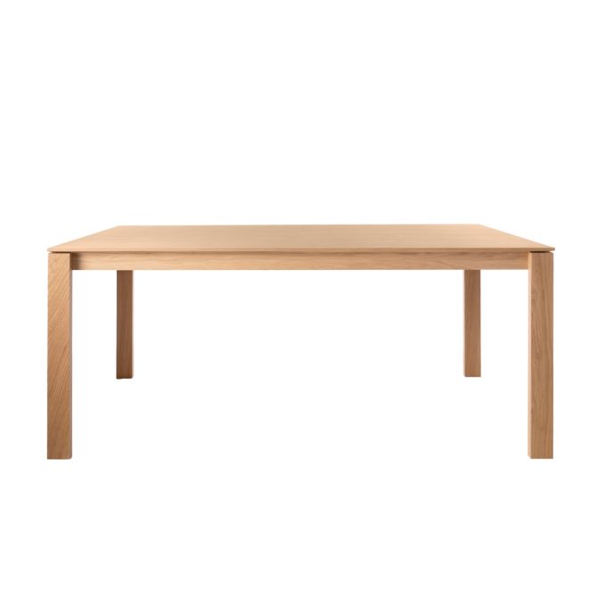 Product photography of a rectangular wooden dining table.